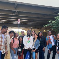 Group of students posing near Bus stop doing duck face